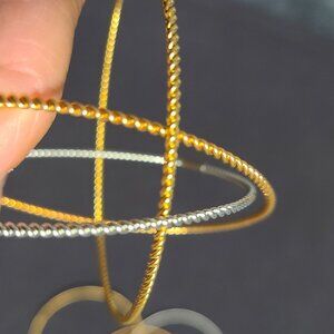 Bundle of three strands of two color necklace and 3-set of tri-colored bracelets